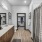 Primary bathroom with double vanity sinks and walk-in closet