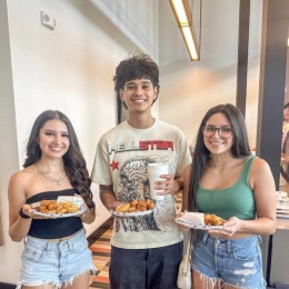 friends with food from the apartment lobby or social event