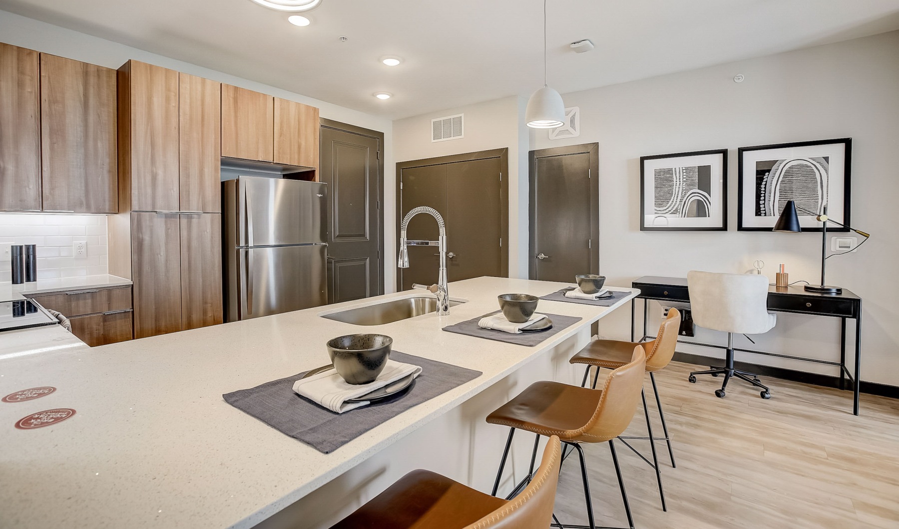 a kitchen with wooden cabinets