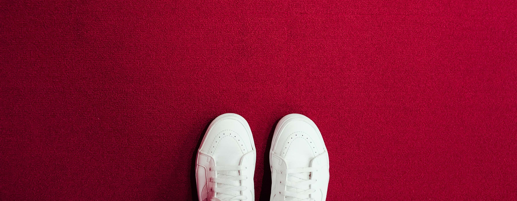 white shoes on red carpet